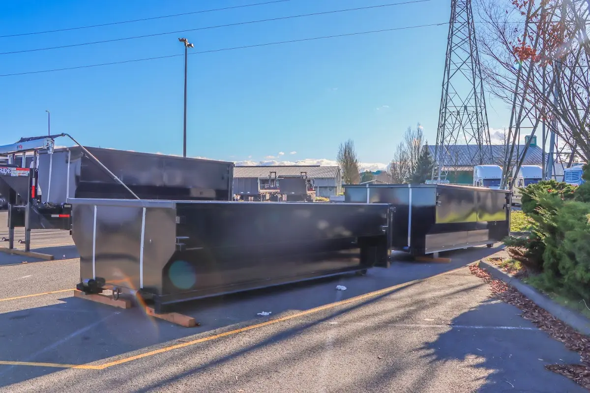 Roll-off dumpster ready for waste disposal at job site for Concrete Dumpster Rental in Auburndale